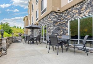 Hotel exterior patio with tables and chairs